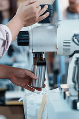 Barista brewing coffee close-up