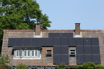 Solar panels on a roof of a house	