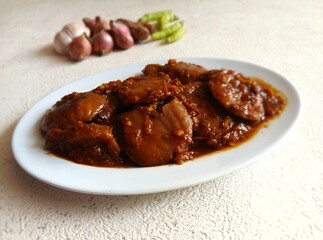 Rendang Jengkol, dogfruit simmered in spices and coconut milk. Indonesian traditional comfort food, with a spicy savory taste typical of rendang and a legit jengkol texture.