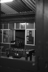 black and white living room with a table football