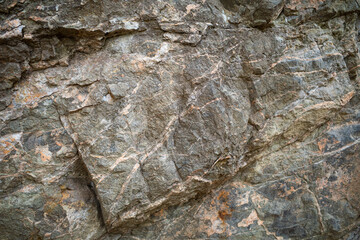 Natural dark stone texture close-up surface background with rough texture