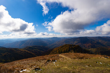 Panoramic view of autumn Carpathian mountains under cloudy sky