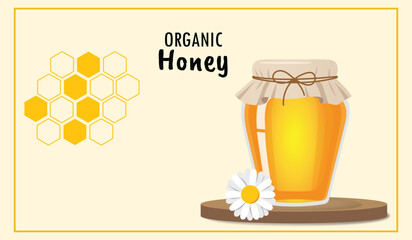 Organic honey jar on wooden stand with chamomile flower and honeycomb