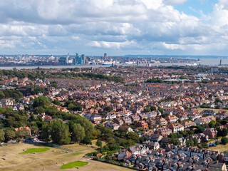 Aerial view of dense housing in Wallasey with Liverpool skyline, Wirral, England