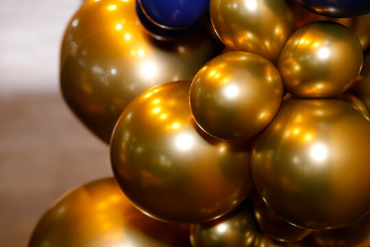 Vibrant golden and blue balloons elegant festive arrangement