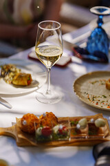 Enjoying gourmet dishes and wine in a sunny setting