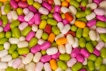 Sweet multicolored candies isolated on white background.