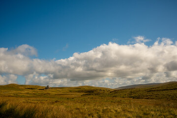 Fototapeta premium Remote Stone Cottage Among Rolling Hills in Snowdonia, Wales