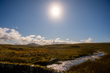 Sunlit River Flowing Through Open Moorland, Snowdonia Wales