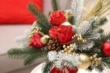 Beautiful composition with fir tree branches indoors, closeup