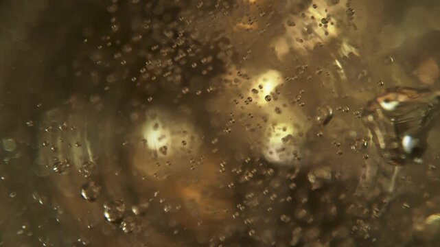 Super Slow Motion Shot of Pouring Champagne with Camera Motion Into Liquid at 1000fps.