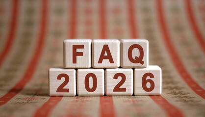 Numbers 2026 and text FAQ on cubes on a ornament background