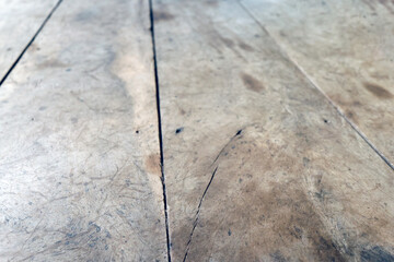 Old brown wooden surface with scratches and rough texture, creating a natural vintage feel. Perfect for background or wooden table texture