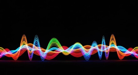 Vivid, glowing rainbow waves flow on a black background
