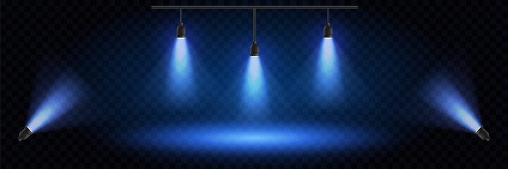 Blue stage lights with glowing particles on a dark background