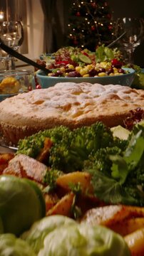 Vertical video camera sliding along table with vegetarian salad made of beans and corn concept healthy food thanksgiving dinner christmas feast family celebration organic lifestyle holiday mood