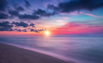 Beautiful sunset on the beach. Panoramic view of the sea.
