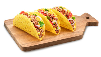 Mexican meat tacos or beef stuffed tortillas on wooden serving board. File contains clipping path.