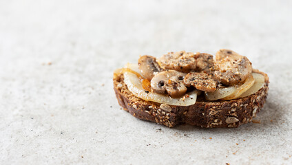 Mini open sandwich with grilled onions and mushrooms