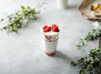 Iced strawberry latte in a takeout cup