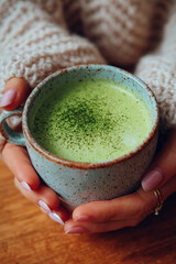 Hot green drink with milk.