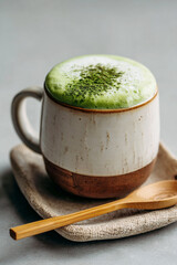 Hot green drink with milk.
