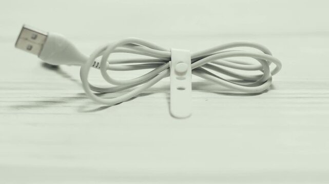 Cable ties for cords and cables organizationon a table.
