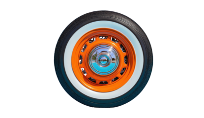 Close-up of a classic car wheel, bright orange rim, white tire, with a black background