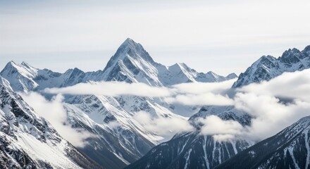 Obraz premium Majestic Mountain Range Peaks Covered in Snow with Clouds and Pine Trees