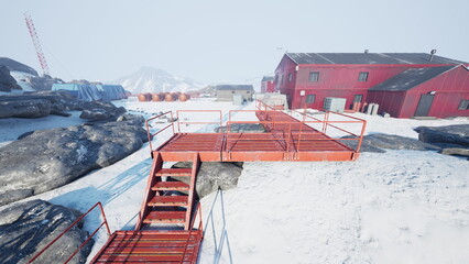 Bright red walkway made of metal stretches over snowy terrain, connecting various buildings and structures in a frosty Antarctic research station. © icetray
