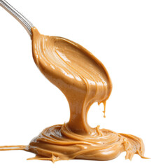 A spoonful of peanut butter is dripping from a spoon