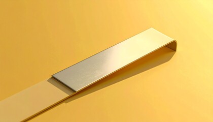 Elegant curved metallic strip on a vibrant yellow background.