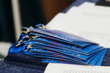 Process of checking in on conference congress forum event, registration desk table, visitors and...