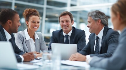 A diverse group of professionals engaged in a collaborative meeting in a modern office environment, discussing strategies and ideas.
