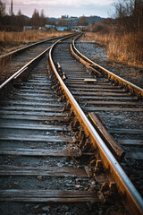 Obraz premium Curved railroad tracks splitting into fog moody atmosphere on transparent background