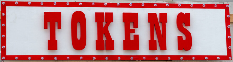 Tokens for rides at amusement park on a white background