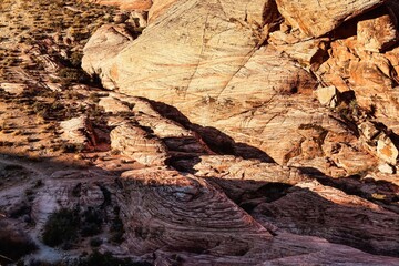 Vibrant Red Sandstone Peaks Rise Majestically Against Azure Skies in Red Rock Canyon's Ancient Desert Embrace, Nevada