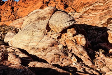 Vibrant Red Sandstone Peaks Rise Majestically Against Azure Skies in Red Rock Canyon's Ancient Desert Embrace, Nevada
