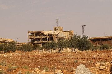 War damaged building in Aleppo, Syria, showing destruction from heavy battles. Powerful footage symbolizing war aftermath, humanitarian crisis, and urban reconstruction potential.