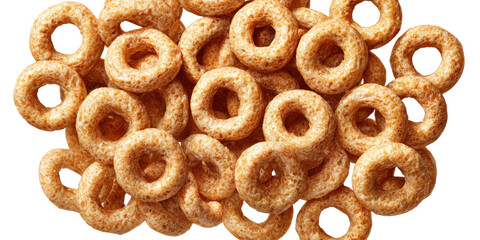 A close-up image showing a pile of round, cereal pieces. They are brown and have a ring shape