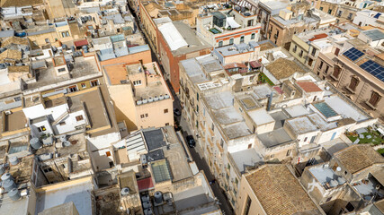 Aerial view of an alley in Trapani, Sicily, Italy. In the historic center of the city, among the narrow streets, there are many houses and palaces.