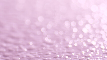 Abstract blurred background featuring a soft pink color and bokeh effect