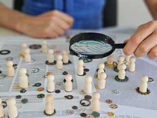 Individuality of people skills. Wooden figures of people with different gears. Test people communication and teamwork skills concept