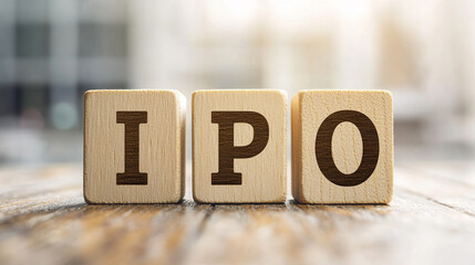Modern minimalist image of wooden blocks spelling “IPO” on a bright white table. Represents investment, savings, finance, and healthcare, ideal for clean branding, business, and digital design project