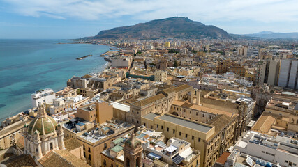 Aerial view of houses and buildings in the historic center of Trapani, Sicily, Italy. It is a beautiful city overlooking the Mediterranean Sea, with a mountain at the horizon.