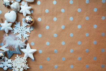 Christmas festive background - basic classic pattern, copy space. Silver and white trendy decorations: disco balls, fluffy Christmas tree toys. Merry Christmas atmosphere and home coziness concept