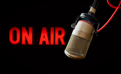 Microphone in radio studio and on air sign
