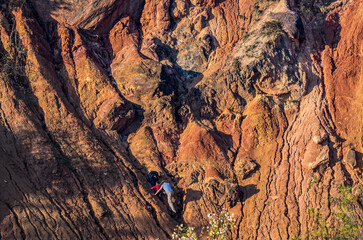 Autumn light on red rocks
Two people climb the sunlit red rocks glowing with the warm tones of autumn.