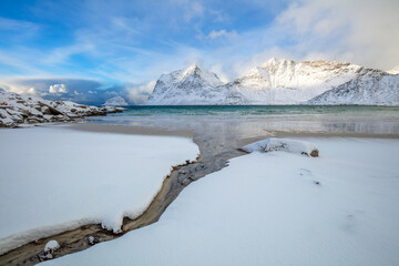 Stream and Winter Fjord in Lofoten