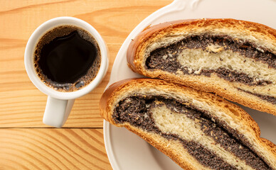 Poppy seed cake, cut into pieces, macro, top view.